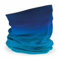 The Beechfield BC905 is a neck gaiter featuring a blue gradient design with shades ranging from dark to light, positioned upright and folded against a plain white background.