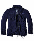 The BD301 jacket by Build Your Brandit features a navy blue military style, multiple pockets, a high collar, and is partially unzipped.