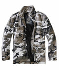 A camouflage jacket incorporating shades of gray, black, and white, complete with a high collar and multiple pockets. The interior features a black lining, showcasing the Build Your Brandit label on the inner tag.