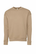 The BE045 by Bella + Canvas, showcased on a white background, is a plain beige crewneck sweatshirt. It comes with long sleeves, ribbed cuffs, and a ribbed waistband for a simple and casual look.