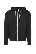 The image showcases a BE106 black zip-up hoodie by Bella + Canvas, featuring white drawstrings and front pockets, set against a white background.