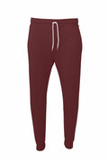 The Bella + Canvas BE126 sweatpants, with a burgundy color and a white drawstring waistband, are displayed against a white background. They feature cuffed ankles and boast a simple, comfortable design.