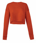 This is the Bella + Canvas BE221, a long-sleeved cropped sweatshirt in orange with ribbed cuffs and a round neckline.