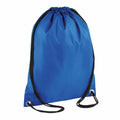 A Bagbase BG005 backpack, featuring a blue exterior and black drawstrings, is set against a white background. It includes metal grommets at the bottom corners for added strength.