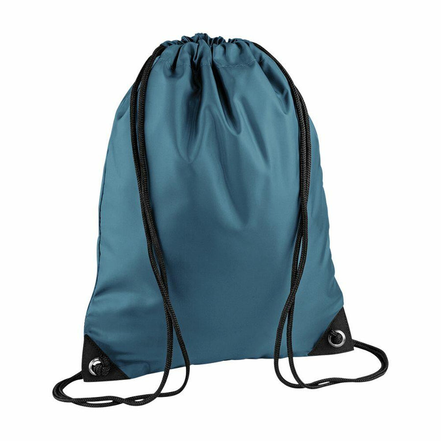 A Bagbase BG010 backpack in teal, featuring black straps and eyelets at the bottom corners.