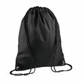 The BG010 drawstring backpack by Bagbase is designed in black with matching cords and features metal eyelets at the bottom corners, set against a plain white background.