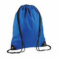 The BG010 by Bagbase is a blue drawstring backpack featuring black strings and reinforced corners. Crafted from a smooth, slightly shiny material, the bag boasts a simple and unadorned design, displayed against a plain white background.