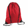 A Bagbase BG010 red drawstring backpack featuring black strings and reinforced corners.