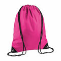 The BG010 by Bagbase is a vibrant pink drawstring backpack featuring black straps and corner reinforcements, designed for easy carrying and storage.