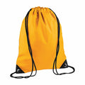 Introducing the BG010 by Bagbase: a vibrant orange drawstring backpack featuring stylish black straps and durable black corner reinforcements. Its cinched top design offers both a casual look and practical functionality.
