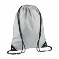 The Bagbase BG010, a gray drawstring backpack featuring black cords and reinforced corners, is displayed against a white background.
