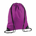 A Bagbase BG010 drawstring backpack in purple, featuring black strings and reinforced corners.