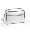 Introducing the Bagbase BG014: a sleek white shoulder bag accented with a black trim and zipper. It includes an adjustable strap for personalized comfort and features a spacious front pocket with a secure zipper. With its minimalist design, this bag is perfect for carrying your essentials.