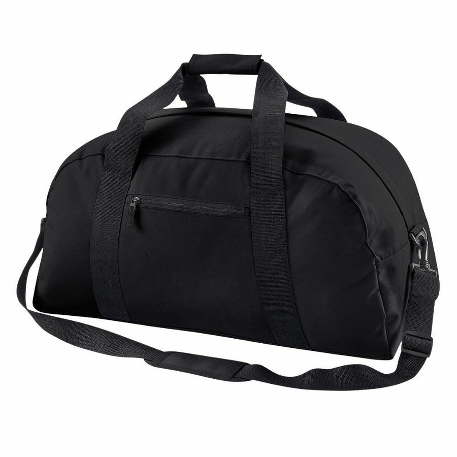 BG022 by Bagbase is a black duffel bag featuring a front zipper pocket, two short handles, and an adjustable shoulder strap, all showcased against a white background.