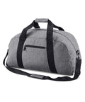 The Bagbase BG022, a gray duffel bag featuring black straps and a front zipper pocket, is showcased against a plain white background.