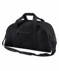 A Bagbase BG022 with a large main compartment, a front zippered pocket, two sturdy handles, and an adjustable shoulder strap. The simple and sleek design is ideal for travel or gym use.
