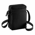 The BG030 by Bagbase is a black crossbody bag featuring two zippered compartments and an adjustable strap.