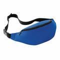 BG042 by Bagbase is a fanny pack in blue with a black adjustable strap and a zippered compartment.