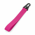 A BG100 pink fabric strap from Bagbase, featuring a black plastic hook at one end.