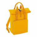 Introducing the Bagbase BG118: a vibrant yellow backpack featuring a convenient fold-over flap with a sleek black buckle closure. It boasts a front zippered pocket, adjustable shoulder straps, and dual carrying handles on top for versatile use.