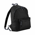 The BG125 backpack from Bagbase comes in black and features a front zipper pocket and dual zippers for the main compartment. It is designed with adjustable shoulder straps and includes a carrying loop on top.
