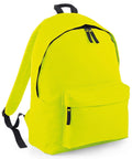 Introducing the Bagbase BG125: a vibrant yellow backpack designed with black zippers, adjustable shoulder straps, a convenient front zip pocket, and a top handle.