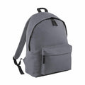 Introducing the Bagbase BG125, a minimalist gray backpack designed with a spacious main compartment, front zippered pocket, and adjustable shoulder straps. Crafted from durable fabric, it also features a convenient black top handle.