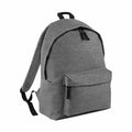 Introducing the Bagbase BG125: a sleek gray backpack featuring adjustable straps and a convenient top handle. This minimalist design includes a spacious main compartment and a front zippered pocket, both equipped with durable black zippers, crafted from sturdy fabric for lasting reliability.
