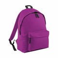 The Bagbase BG125 is a vibrant purple backpack with black zippers and adjustable black straps, featuring a large front pocket. It is showcased against a plain white background.