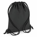 The image features a Bagbase BG137, an all-black drawstring bag with two cords on each side, set against a white backdrop.