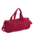 Introducing the Bagbase BG140, a vibrant red cylindrical duffel bag equipped with short handles and a long adjustable shoulder strap. It also includes a convenient zippered pocket on the side.