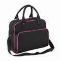 The Bagbase BG145 is a black laptop bag with pink trim, two handles, a shoulder strap, and a front zippered pocket.