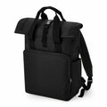 The BG18L by Bagbase is a black backpack featuring a roll-top closure, a front zipper pocket, and adjustable shoulder straps.