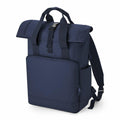Introducing the Bagbase BG18L: a navy blue backpack featuring a roll-top closure secured by a buckle. It boasts adjustable shoulder straps, a spacious front pocket with a zipper, and two convenient side pockets, all wrapped up in a minimalistic and functional design.