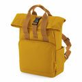 Introducing the Bagbase BG18S: a stylish mustard yellow backpack featuring a roll-top design, complemented by brown adjustable straps and a secure black buckle. It’s equipped with a front zippered pocket and side pockets, perfect for casual outings or travel adventures.