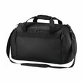 The Bagbase BG200 is a black duffel bag featuring multiple zippered compartments and a detachable shoulder strap.