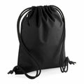 The Bagbase BG281 is a black drawstring backpack featuring a zippered pocket on one side and black straps tied at the ends.