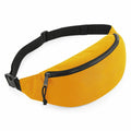 The BG282 by Bagbase is a yellow fanny pack featuring a black adjustable strap and a zippered main compartment. It includes a small cord on the zipper pull for easy opening, and is displayed against a white background.