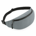 The BG282 by Bagbase is a sleek and minimalist gray fabric fanny pack featuring a black adjustable strap with a secure black buckle. It has a zipper closure, making it ideal for carrying small personal items.