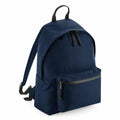 The Bagbase BG285 is a navy blue backpack featuring a front zippered pocket, adjustable straps, and a top handle for easy carrying. Its design is simple and functional.