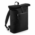 The Bagbase BG286 is a black roll-top backpack featuring adjustable straps and a front zipper pocket.