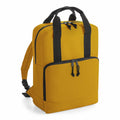 Introducing the Bagbase BG287: a yellow backpack with black zippers and straps, equipped with a front zip pocket and a convenient top handle.