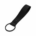 The BG324 by Bagbase is a black keychain that includes a looped strap with a button snap and an attached metal ring.