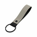 A Bagbase BG324 keyring featuring a flat looped strap in gray and black, complete with a metal ring.