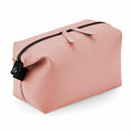 The Bagbase BG330 is a toiletry bag in pink, featuring a black zipper and a side strap.