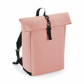 A Bagbase BG335 roll-top backpack in pink, featuring black straps and a black buckle closure.