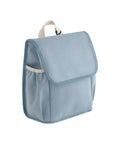A light blue Bags lunch bag with a front flap, side pocket, and beige top handle, displayed against a white background.