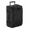 The Bagbase BG481 is a black wheeled suitcase equipped with a telescopic handle, two front pockets, and side straps for securing contents.