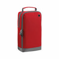 The BG540 is a tall, rectangular red insulated cooler bag by Bagbase. It features a gray base and zipper, a carrying handle on top, and a small metal grommet near the upper side.