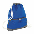 A Bagbase BG542 drawstring backpack featuring a blue color with a gray accent bottom and a front zippered pocket is shown.